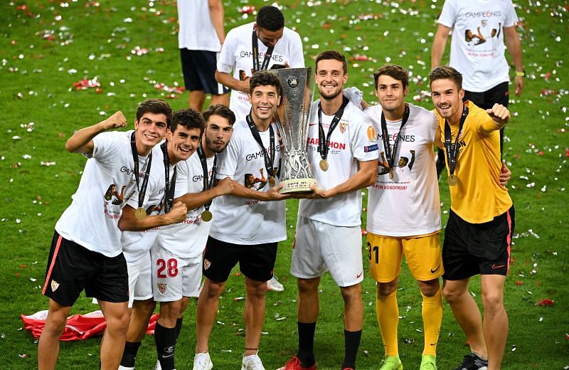 Sevilla players with the 2019-20 Europa League trophy.